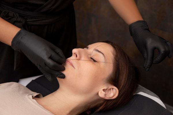 woman-going-through-microblading-procedure_23-2149103128